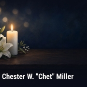 Fostoria News Memorial candle and lilies for Chester W. Chet Miller obituary.